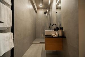 a bathroom with a sink and a shower at Hotel MiraMar smart room in Kovelʼ