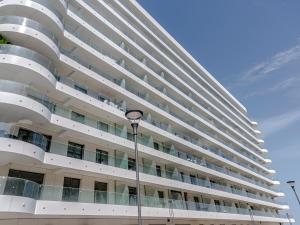 a tall building with a street light in front of it at Sea On in Mamaia