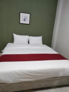 Postel nebo postele na pokoji v ubytování Donata House