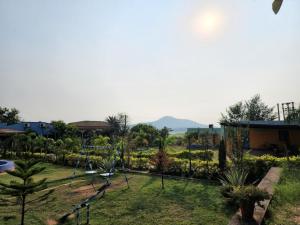 a view of a park with a swings at Baranti Eco Tourism Resort, Muradi 