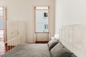 Tempat tidur dalam kamar di Guia Getaway Private Rooms