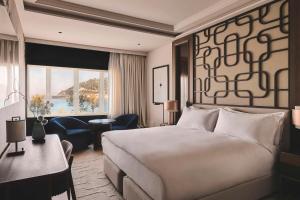a hotel room with a bed and a large window at Nobu Hotel San Sebastián in Donostia-San Sebastián