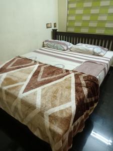 Uma cama ou camas num quarto em Cloudnine Home Thrissur