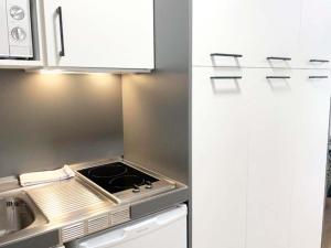 Kuchyň nebo kuchyňský kout v ubytování Apartamentos Midi 3000