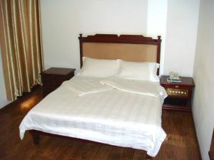 Postel nebo postele na pokoji v ubytování Jess Hotel