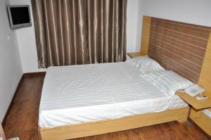 Postel nebo postele na pokoji v ubytování Jess Hotel