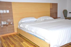 Postel nebo postele na pokoji v ubytování Jess Hotel