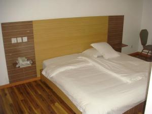 Postel nebo postele na pokoji v ubytování Jess Hotel