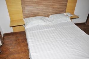 Postel nebo postele na pokoji v ubytování Jess Hotel