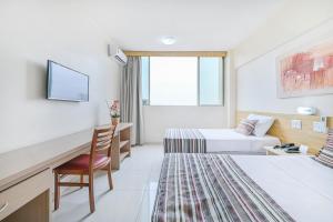 Ένα ή περισσότερα κρεβάτια σε δωμάτιο στο Hotel Nacional Inn Piracicaba