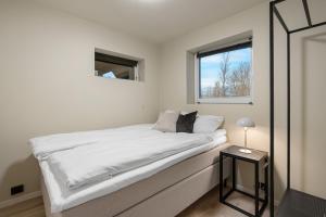 Postel nebo postele na pokoji v ubytování Enter Tromsø - 3 Bedroom Home