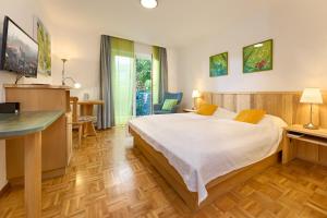 Postel nebo postele na pokoji v ubytování Hotel-Bio Gasthaus Am Felsenkeller