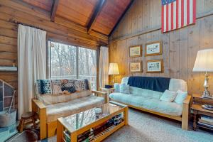 a living room with a couch and a chair at Log Ski Lodge in Wilmington +68 photos
