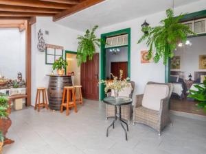 a living room with a table and chairs at Live Arico Casa Abuela in Arico el Nuevo