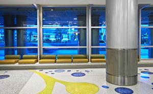a large blue and white water fountain in a building at Miami International Airport Hotel in Miami