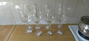 a group of wine glasses sitting on top of a table at Unit 24 Pendleberry Grove Holidays in Bela-Bela