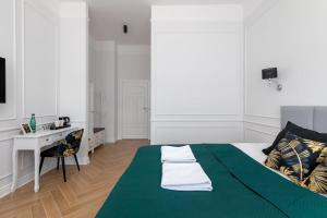 Posteľ alebo postele v izbe v ubytovaní Lwowska 9 - Cozy & Comfortable Studio by Noclegi Renters
