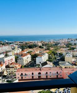 an aerial view of a city with buildings and the ocean at Studio with sea view in Cascais in Cascais