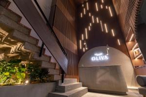 an entrance to an olivia sign in a building at Oliva plaza hotel in Guadalajara