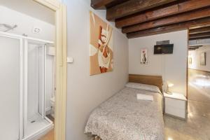 Ein Bett oder Betten in einem Zimmer der Unterkunft Pensión Riosol