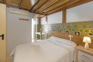 Ein Bett oder Betten in einem Zimmer der Unterkunft Pensión Riosol