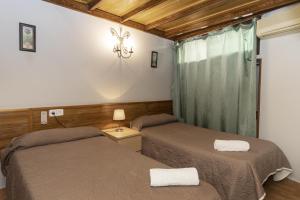 Ein Bett oder Betten in einem Zimmer der Unterkunft Pensión Riosol