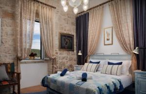 a bedroom with a bed and a large window at Luxury seafront Villa Lighthouse Ligero on Host island - Vis island in Vis