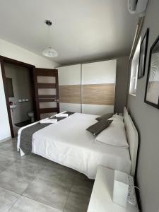 a bedroom with two beds and a bathroom at F3 Room 1, Private Double room with private bathroom and balcony in Msida