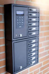 a pay phone is attached to a brick wall at Hökis-Zimmervermietung 8 mit Küchenzeile in Brande-Hörnerkirchen