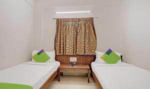 Cama ou camas em um quarto em Hotel Prime Pavilion-MG ROAD