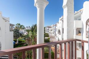 a view from the balcony of a building at El Zoco de Iñaki - Adults Only in Sitio de Calahonda