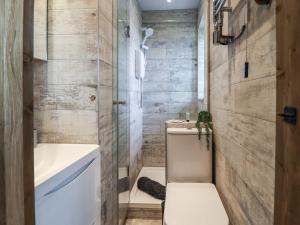 a small bathroom with a toilet and a sink at Wells Cottage in Holmfirth +42 photos