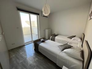 A bed or beds in a room at F7-3 Bedroom two single beds shared bathroom in shared Flat