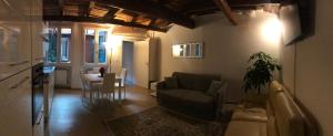 a living room with a couch and a table at Casa Gioia Centro Storico in Bologna