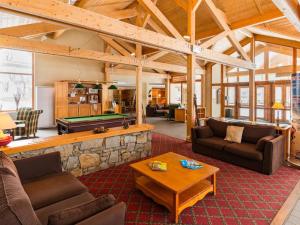 a living room with couches and a pool table at Appartement Valloire, 2 pièces, 4 personnes - FR-1-263-189 in Valloire