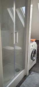a washing machine and a washer in a room at Casa Bella in Weeze +5 photos