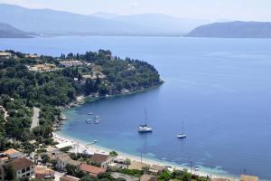 an island with boats in a large body of water at Sun odyssey 43ia in Corfu Town