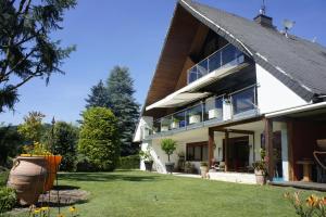 a house with a large yard in front of it at Ferienwohnung Burg Freienstein Blick 4 Sauna in Gammelsbach