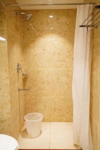 a bathroom with a shower and a toilet at L. R RESIDENCY in Kanchipuram