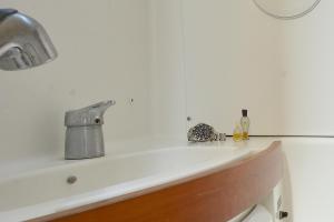 a kitchen sink with a faucet on top of it at Sun odyssey 43ib in Corfu Town