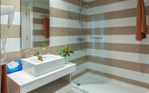 a bathroom with a sink and a shower at Seabel Alhambra Beach Golf & Spa in Port El Kantaoui