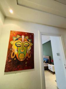 a painting of a lion on a wall at Appartement Marsa Ville in La Marsa