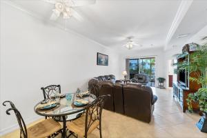 a living room with a table and a couch at 3329 Purple Martin 112 in Punta Gorda +24 photos