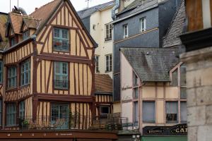 a group of old buildings in a city at Olivier : Élégance* au Cœur* de Rouen* in Rouen
