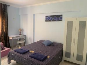 Postel nebo postele na pokoji v ubytování Tenerife Homestay