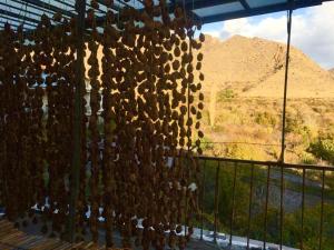 a bunch of shoes hanging from a fence at HOUSE ON THE ROCK in Meghri