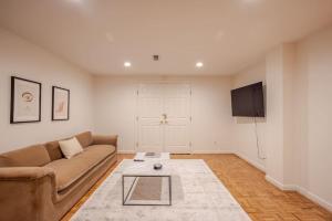 a living room with a couch and a tv at Private, Serene Mt Lookout 5B Retreat with Garage, EV Charging in Cincinnati