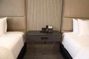 Postel nebo postele na pokoji v ubytování HUNICO HOTEL