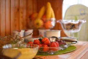 a table with a bowl of strawberries and other fruit at The Beaucliffe Hotel in Blackpool