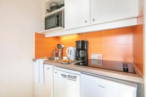 Køkken eller tekøkken på Résidence Pierre & Vacances Les Bergers + 71 billeder